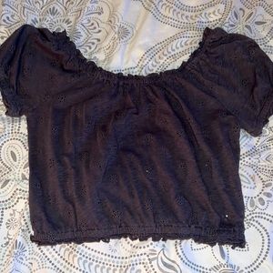 It’s a gray off the shoulder crop top.